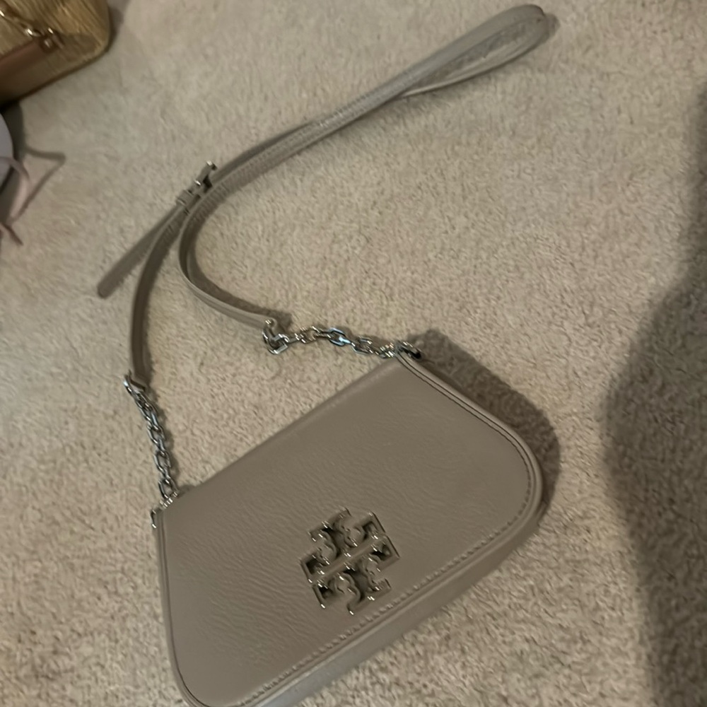 Tory Burch -crossbody bag-tan color.  Slim fitting.  Used two times